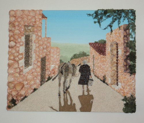 A Cretan lady walks home with her donkey